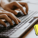 Male Hands Typing on a Wireless Computer Keyboard with icon o JavaScript