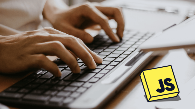 Male Hands Typing on a Wireless Computer Keyboard with icon o JavaScript